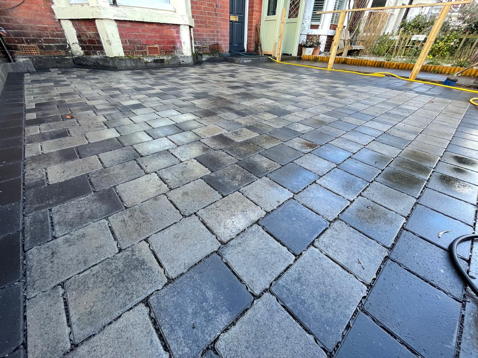 Block paving with a contrasting soldier-course edge restraint — The Vale Company