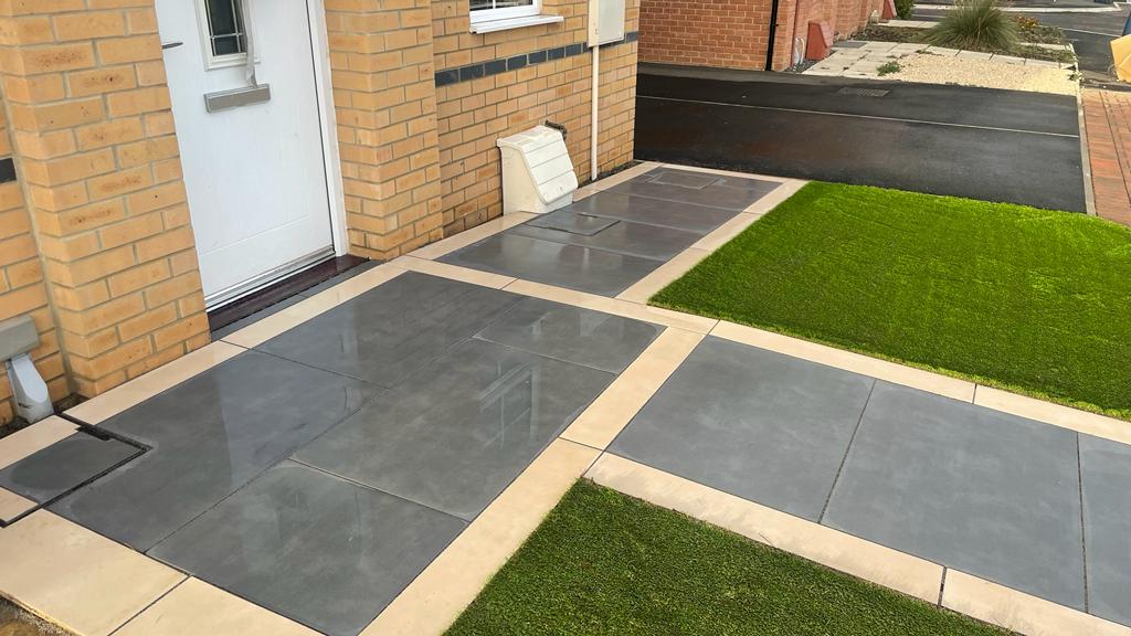Dark grey porcelain front path and threshold with a buff border and a recessed cover — The Vale Company