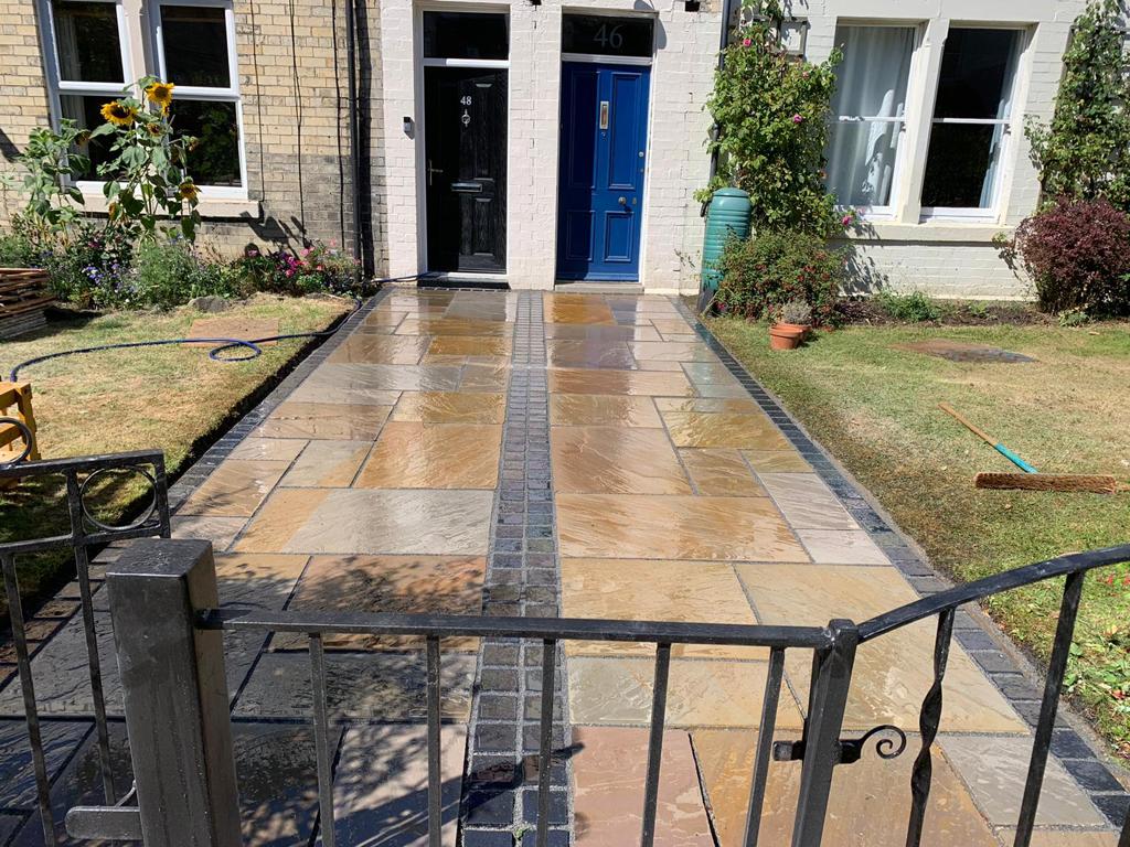 Buff Indian sandstone front path with a charcoal sett banding down the centre — The Vale Company
