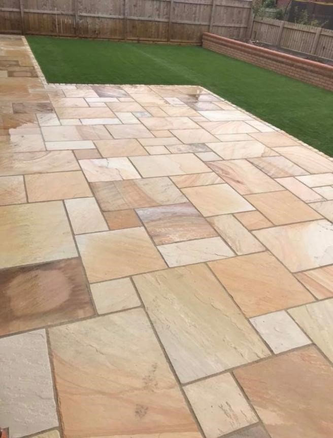 Autumn buff Indian sandstone patio laid in a multi-size random course — The Vale Company