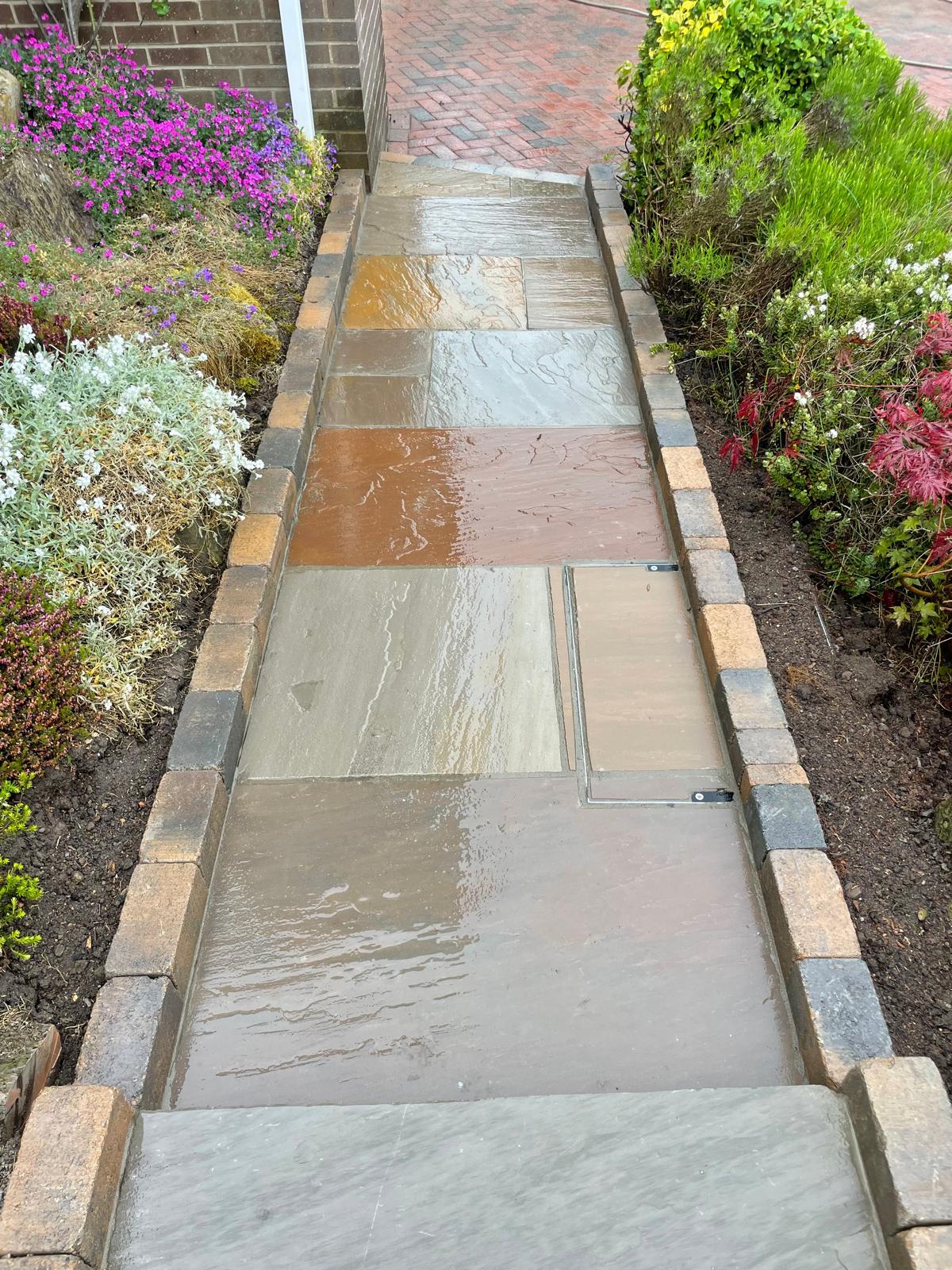 Multi-tone sandstone side path with a tumbled sett edge and a recessed cover infilled to match — The Vale Company