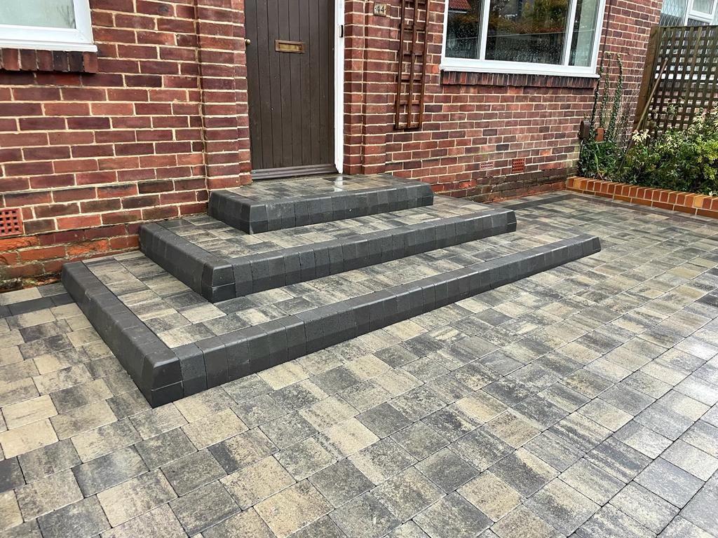 Three-tier squared entrance steps with charcoal block nosings — The Vale Company